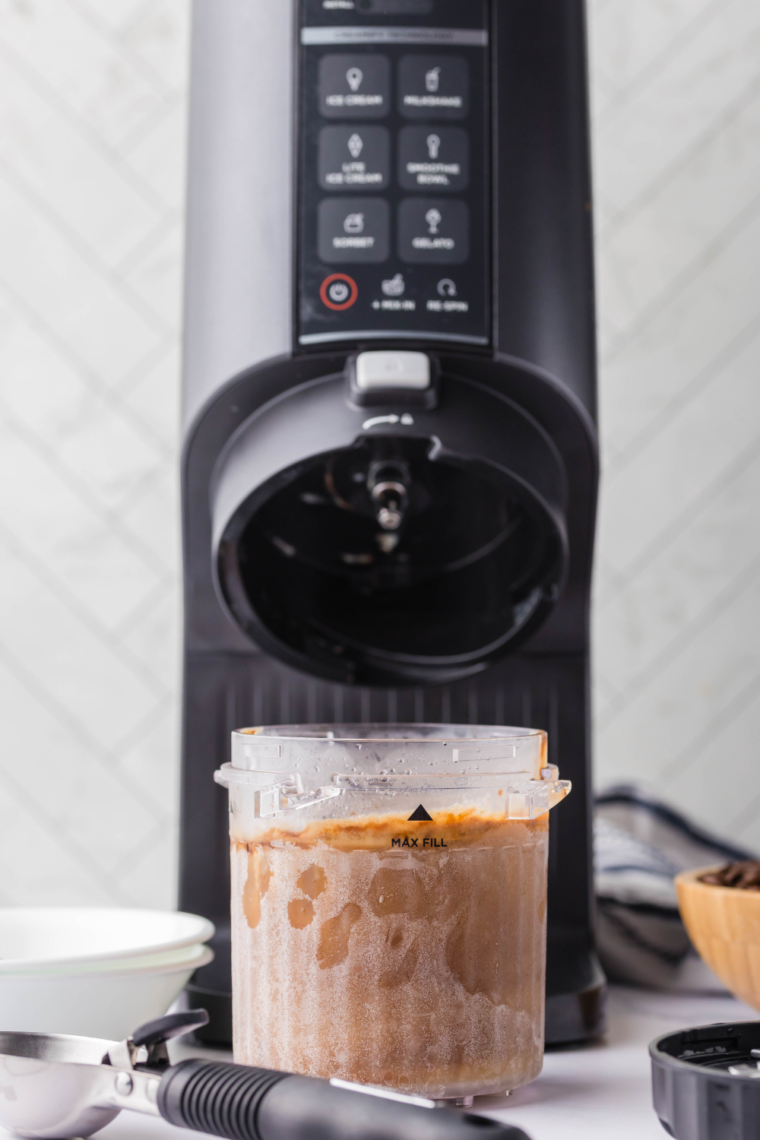 Frozen coffee gelato base placed into Ninja Creami machine