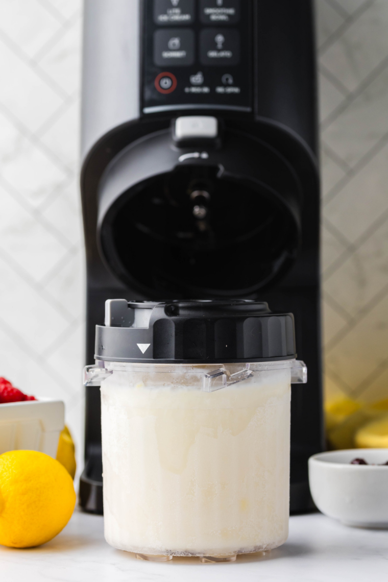 Frozen gelato pint placed in Ninja Creami, churning on Gelato setting