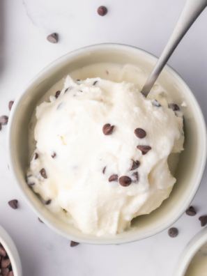 Creamy Ninja Creami stracciatella gelato in a bowl with chocolate flakes throughout.