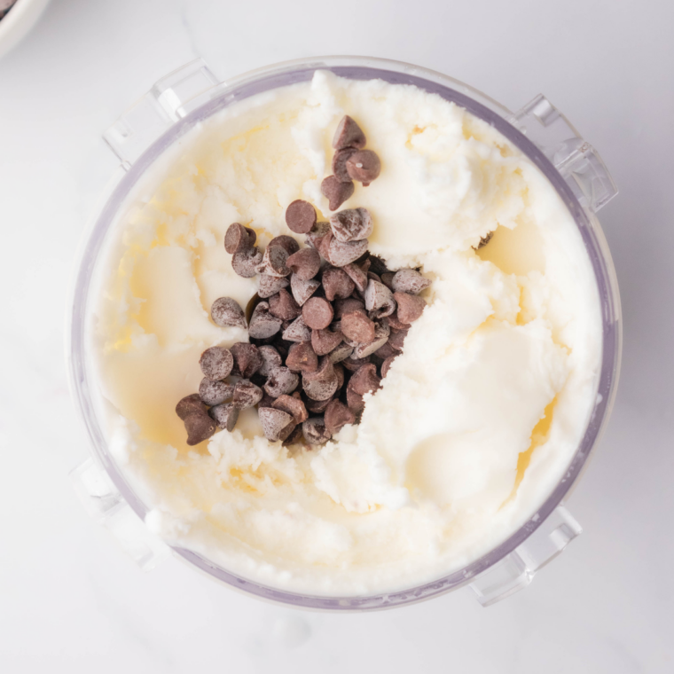 Frozen gelato pint placed into Ninja Creami machine on Gelato setting.