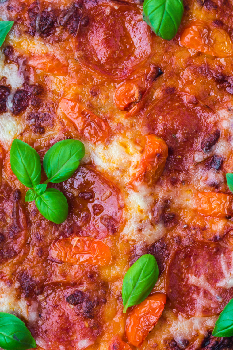 Bake on Ninja Woodfire Grill &ndash; pizza cooking on Ninja Woodfire Grill until golden and bubbly.