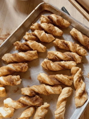 Featured image: Easy puff pastry cinnamon twists baked golden and dusted with sugar