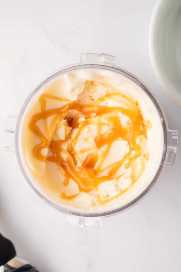 Swirling extra caramel sauce into freshly churned gelato.