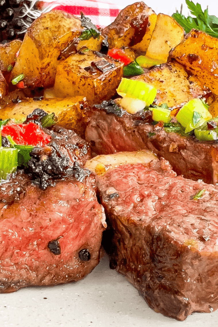 Homemade copycat Kinder’s cowboy butter with garlic, herbs, and lemon in a small bowl for dipping.