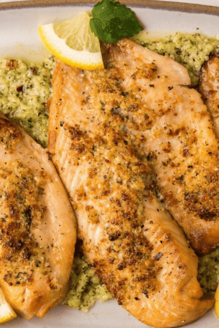 Small bowl of homemade copycat Kinder&rsquo;s honey mustard seasoning with surrounding spices on a wooden surface.