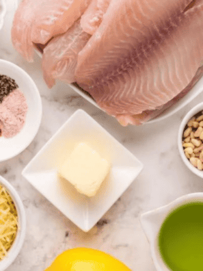 Homemade copycat Kinder&rsquo;s honey mustard seasoning blend in a small bowl with spices on a wooden surface.