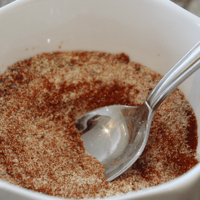 Mixing homemade honey mustard seasoning blend with a whisk until combined.