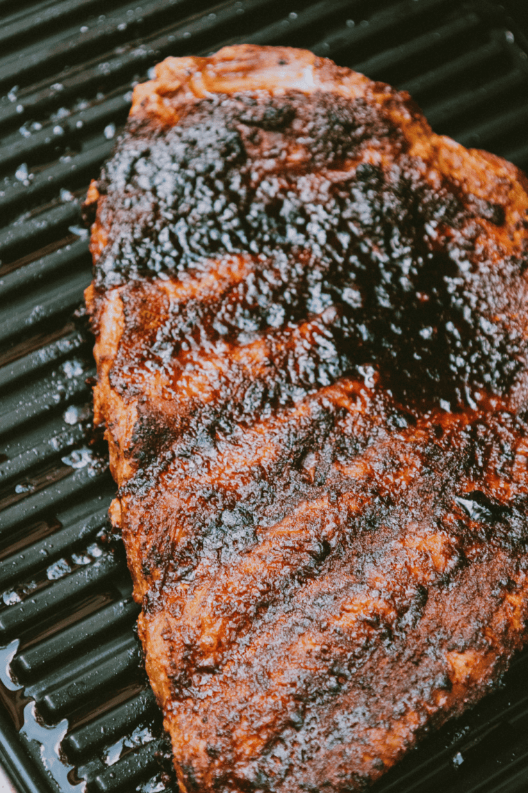 Cooked ribs coated with Copycat Kinder&rsquo;s The Steak Blend, served on a plate