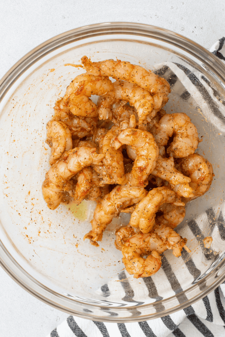 Toss shrimp so the shrimp is well coated with oil and spices.
