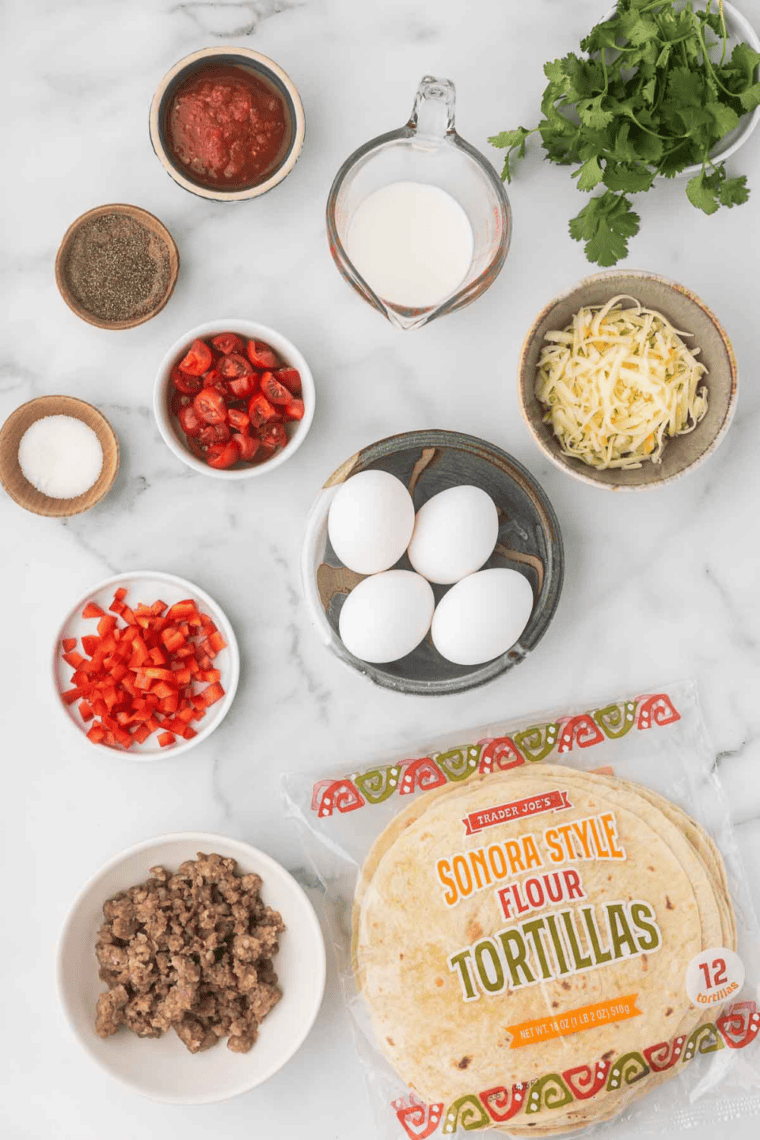 Ingredients needed for Easy Air Fryer Tex Mex Breakfast Burritos on kitchen table.