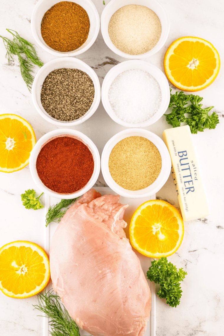 Ingredients needed for Easy Cajun Smoked Turkey Breast Recipe on kitchen table.