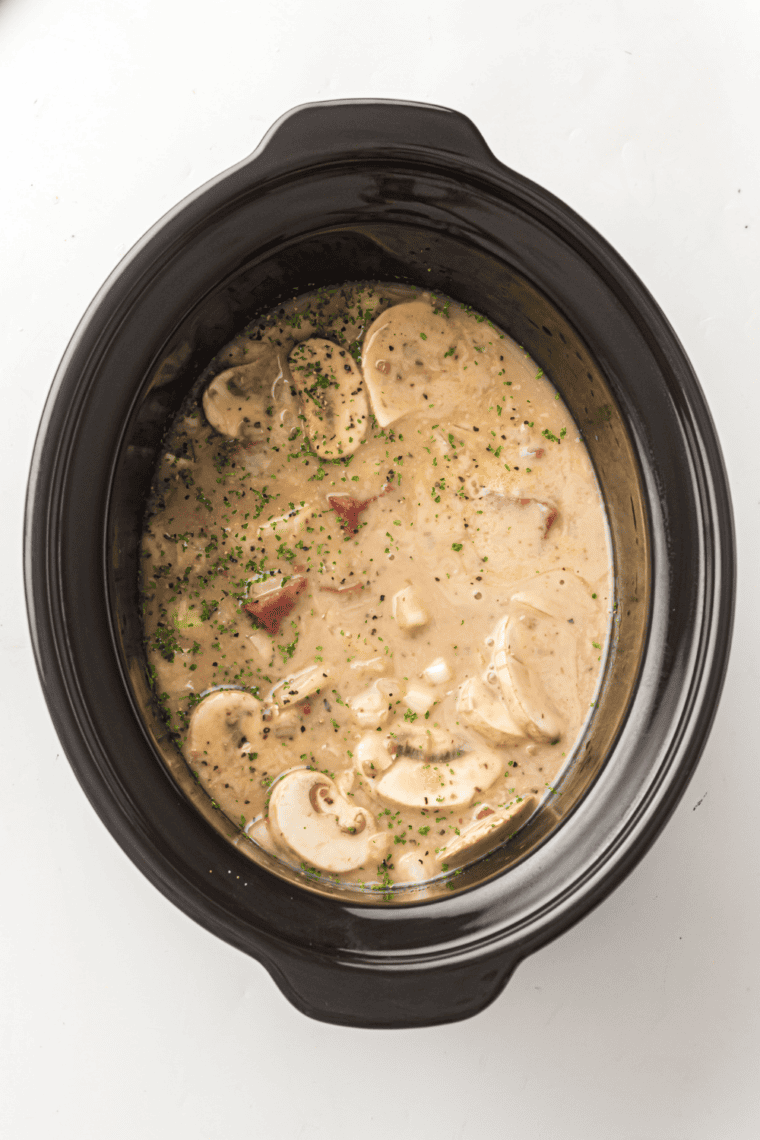 Breaking up seasoning clumps with whisk for smooth mix.