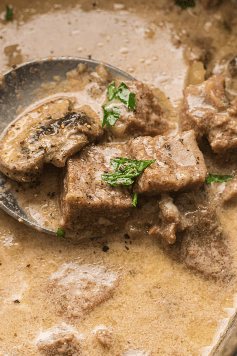 Homemade dry stroganoff sauce mix in a small jar, ready for cooking