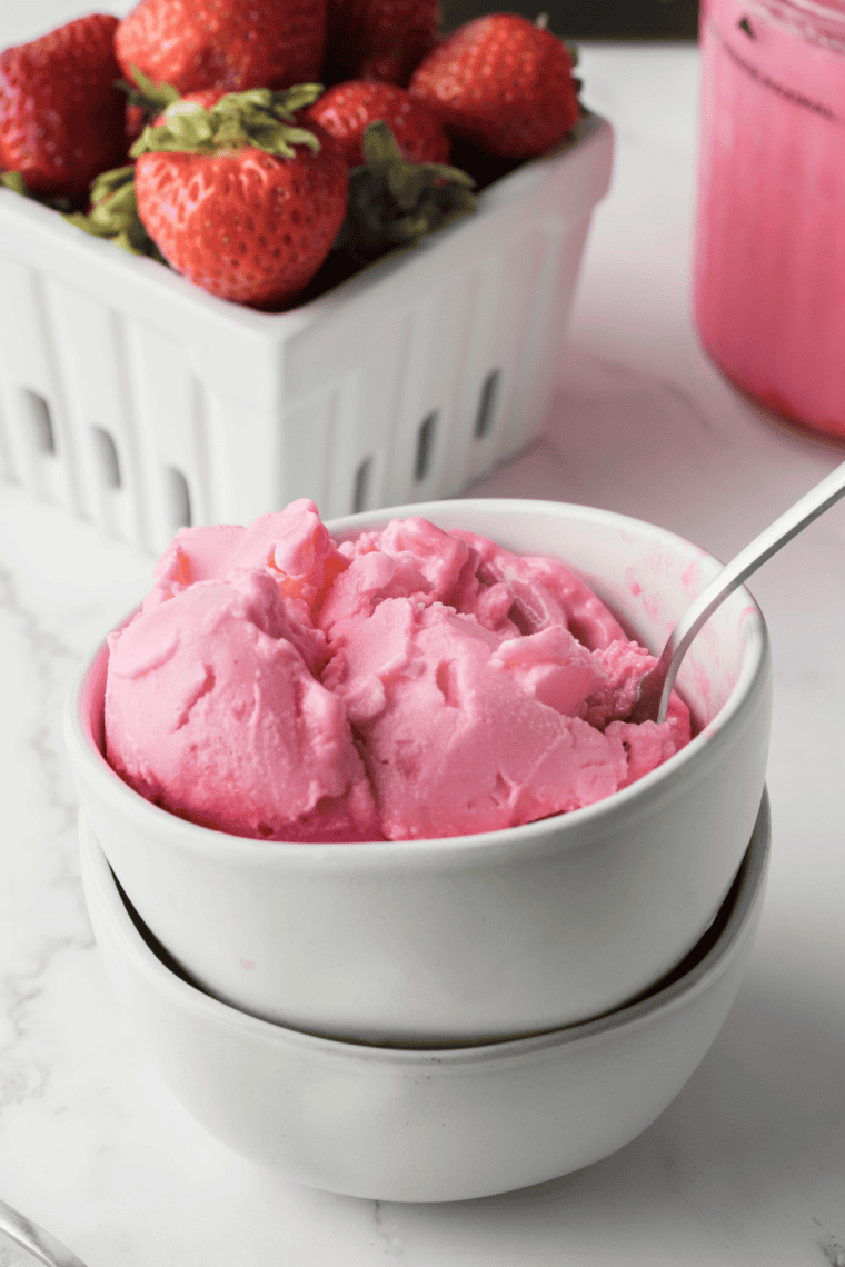 Homemade Ninja Creami copycat bubble gum ice cream in a bowl with pink color and candy pieces. 🍨