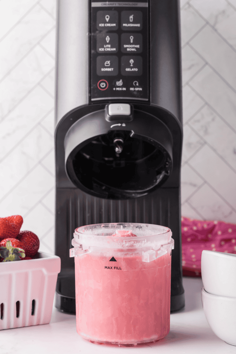 Ninja Creami pint container filled with bubble gum ice cream base ready to freeze.