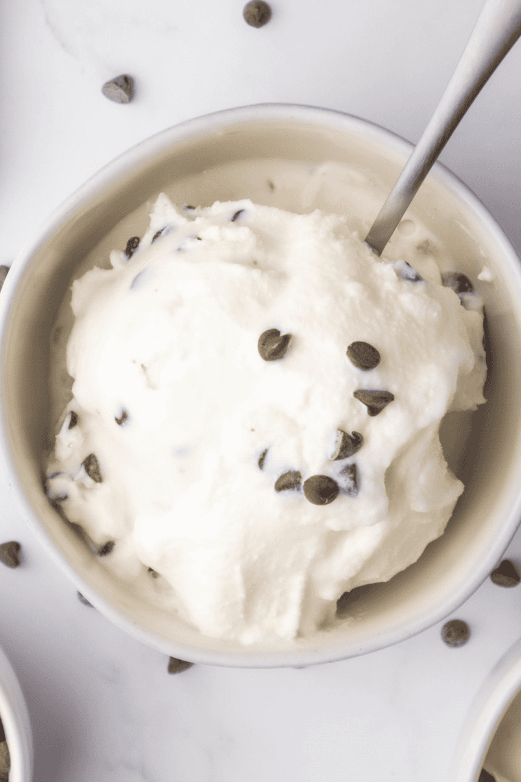 Creamy scoop of Ninja Creami Fior Di Latte sweet cream gelato in a bowl with fresh berries on top