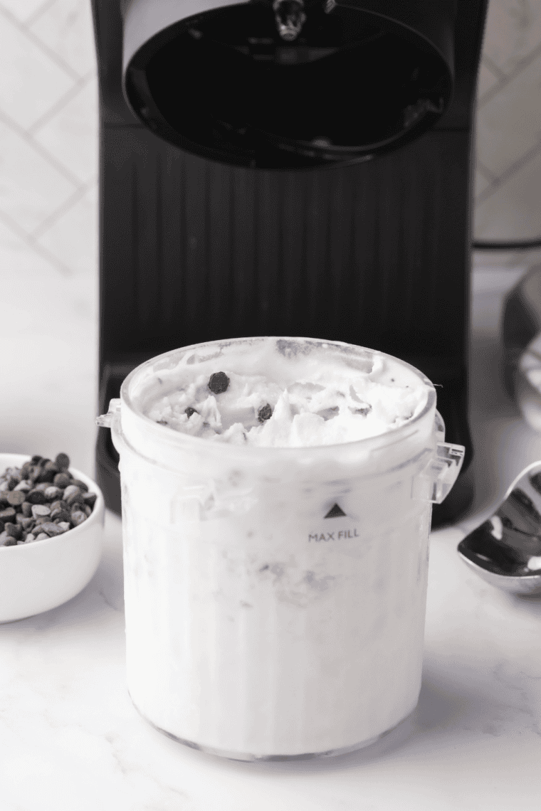 Scoop of Ninja Creami Fior Di Latte sweet cream gelato served in bowl with berries.