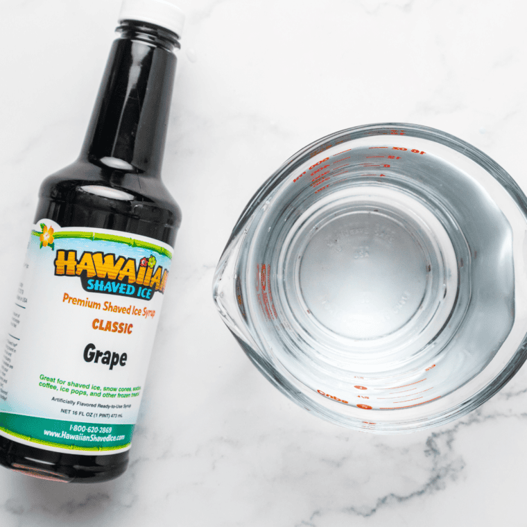 Ingredients needed for Easy Ninja Creami Grape Italian Ice on kitchen table.