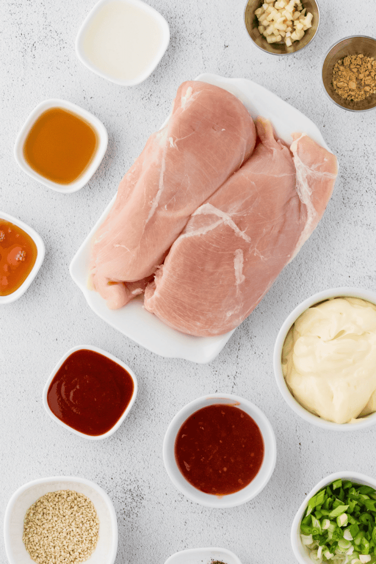 Ingredients needed for Easy Slow Cooker Bang Bang Chicken on kitchen table.