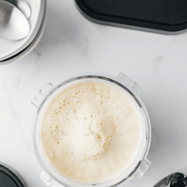 Prepare the Base: Whisking almond milk, heavy cream, sugar, almond extract, and vanilla in a bowl until smooth.