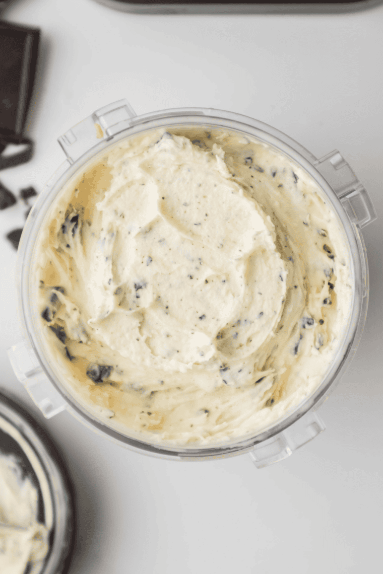 Scoops of homemade Ninja Creami Mom's Makin Cookies ice cream in bowls or cones.