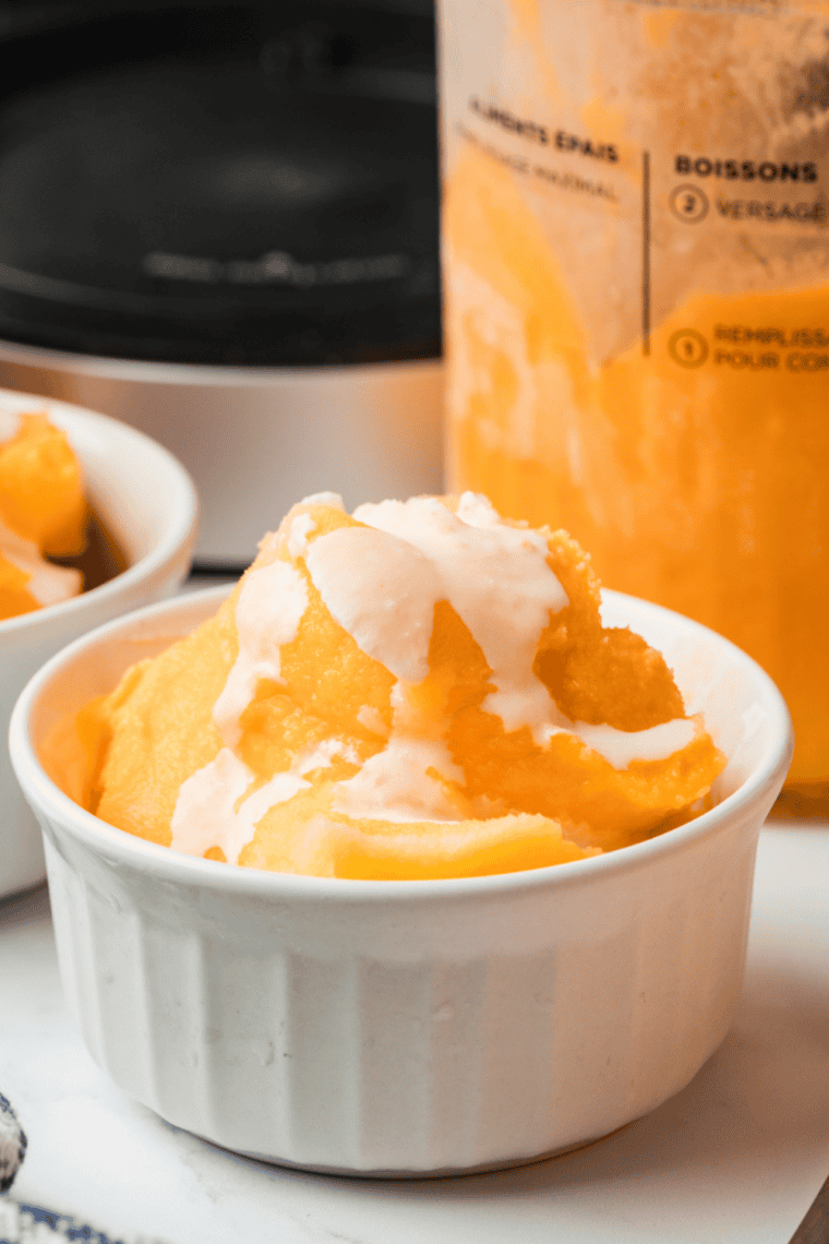 Scooped orange creamsicle Italian ice ready to serve.