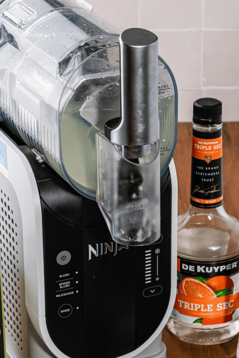 Pour the shamrock shake ingredients into the machine.