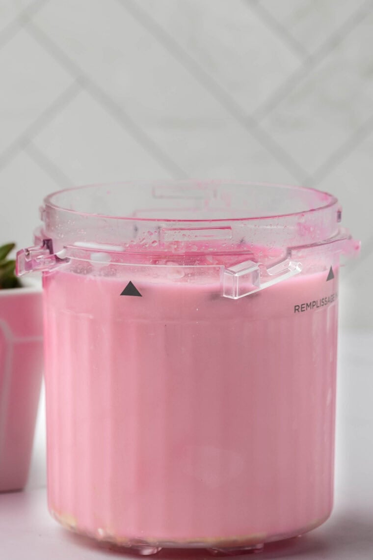 Mixing milk, heavy cream, sugar, and vanilla in a bowl to make Ninja Creami bubble gum ice cream base.