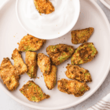 golden, crispy air fryer avocado chips served on a plate for a healthy snack