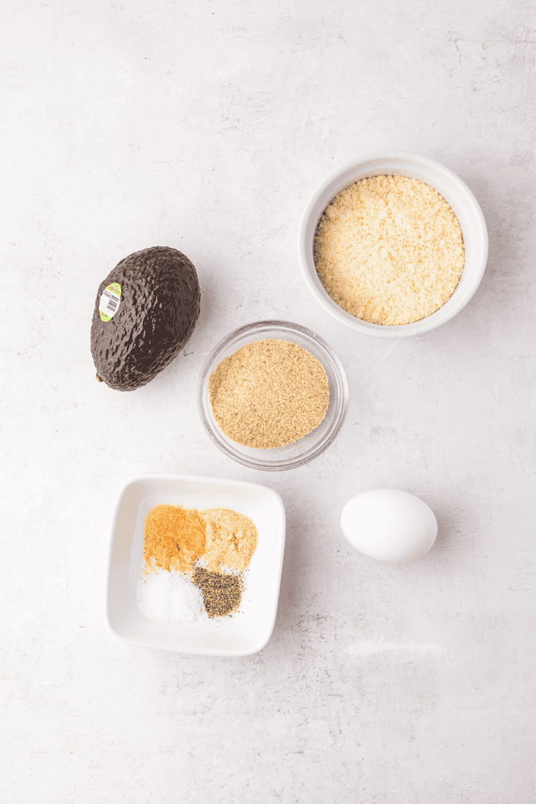 Ingredients needed for Air Fryer Avocado Chips on kitchen table.