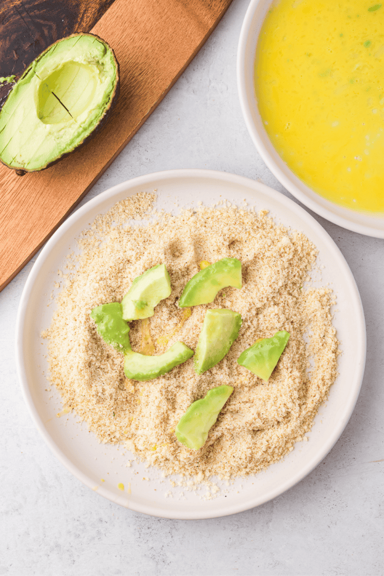 panko breadcrumbs mixed with paprika, Parmesan, garlic powder, cayenne, chili, lime zest in small bowl