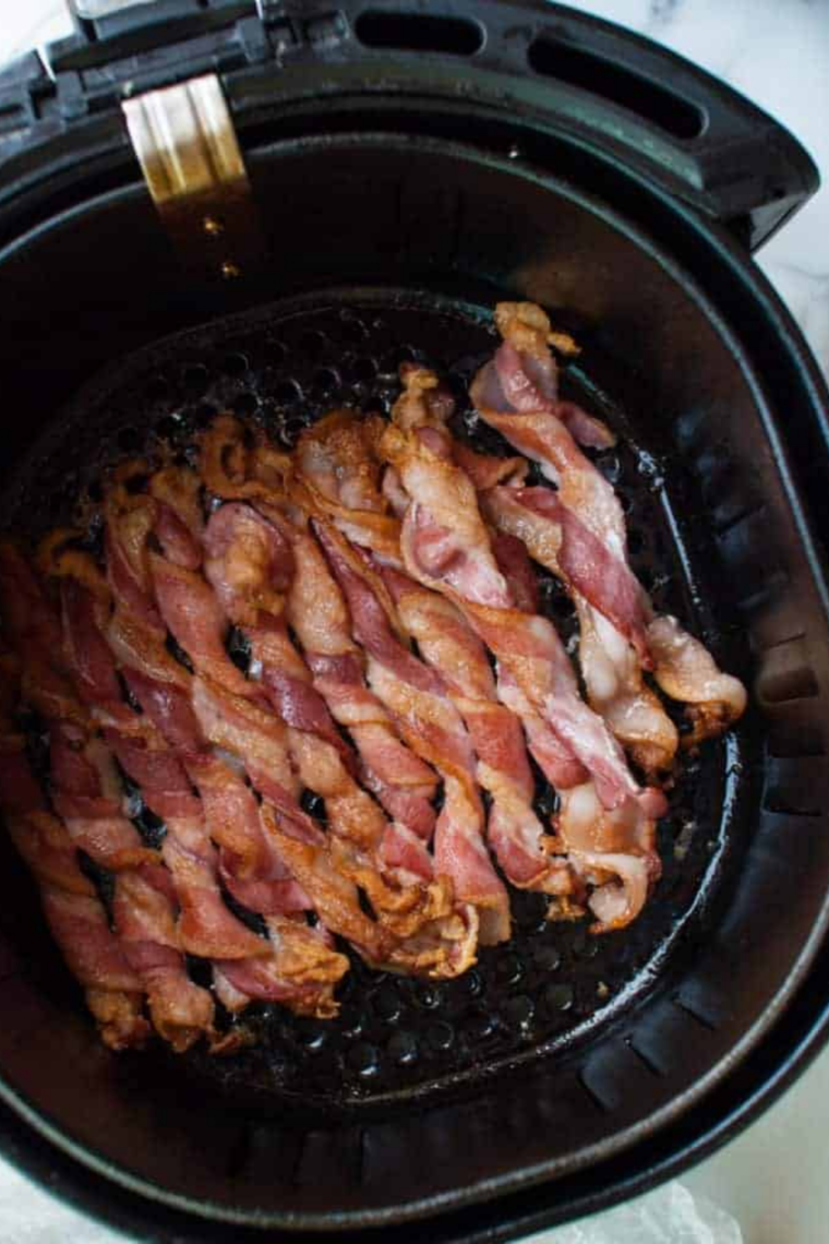 Air fryer bacon cooked at 380&deg;F until crisp and golden