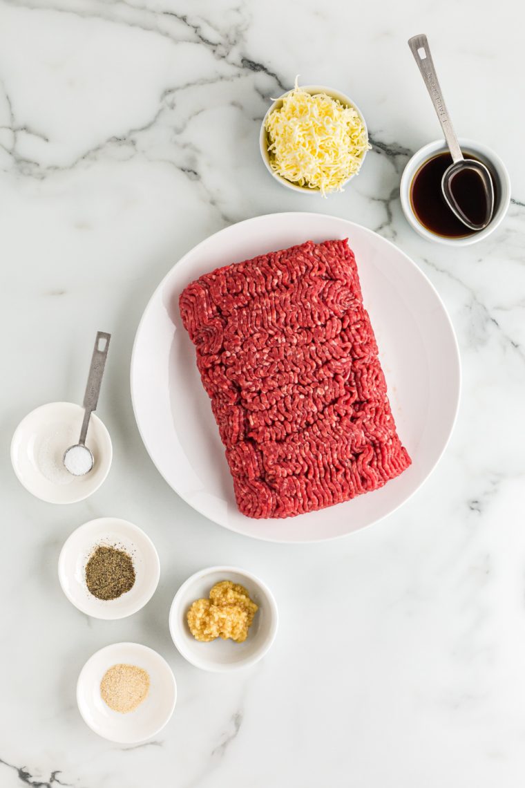 Ingredients needed for Campfire Smash Bacon Cheeseburger on kitchen table.