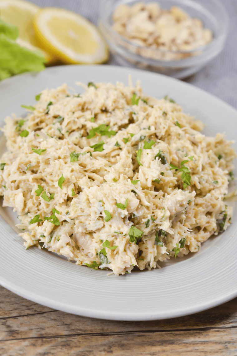 Creamy copycat Chicken Salad Chick Classic Carol chicken salad served in a bowl with shredded chicken and mayonnaise.