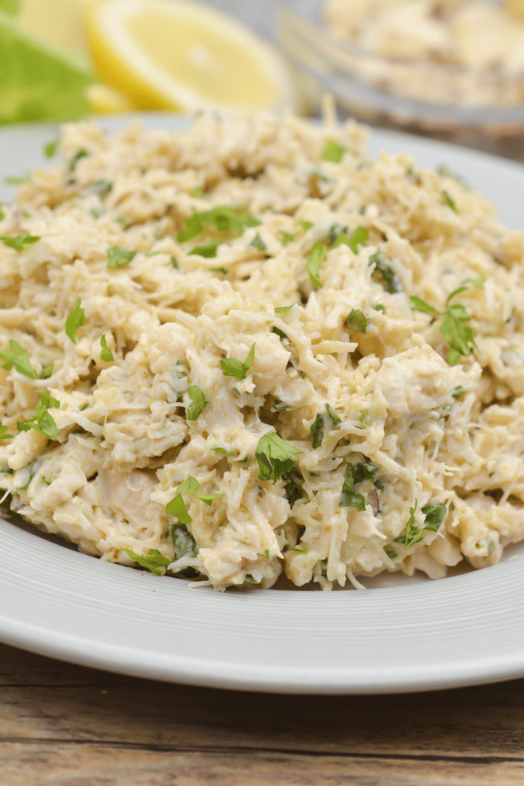 Creamy copycat Chicken Salad Chick Classic Carol chicken salad served in a bowl with shredded chicken and mayonnaise.