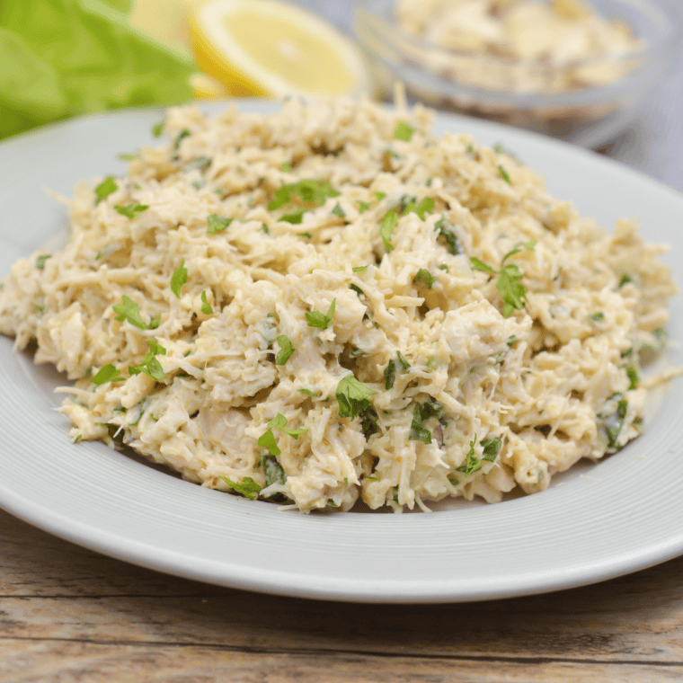 Creamy copycat Chicken Salad Chick Classic Carol chicken salad served in a bowl with shredded chicken and mayonnaise.