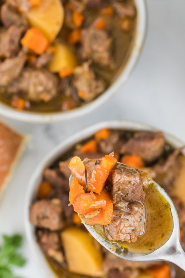 Homemade Dinty Moore style beef stew with tender chunks of beef, potatoes, carrots, and thick rich gravy served in a bowl