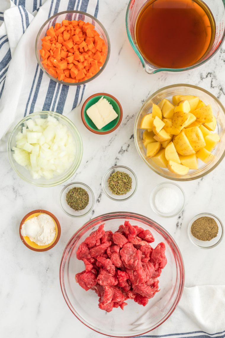 Ingredients needed for Dinty Moore Beef Stew Recipe on kitchen table.