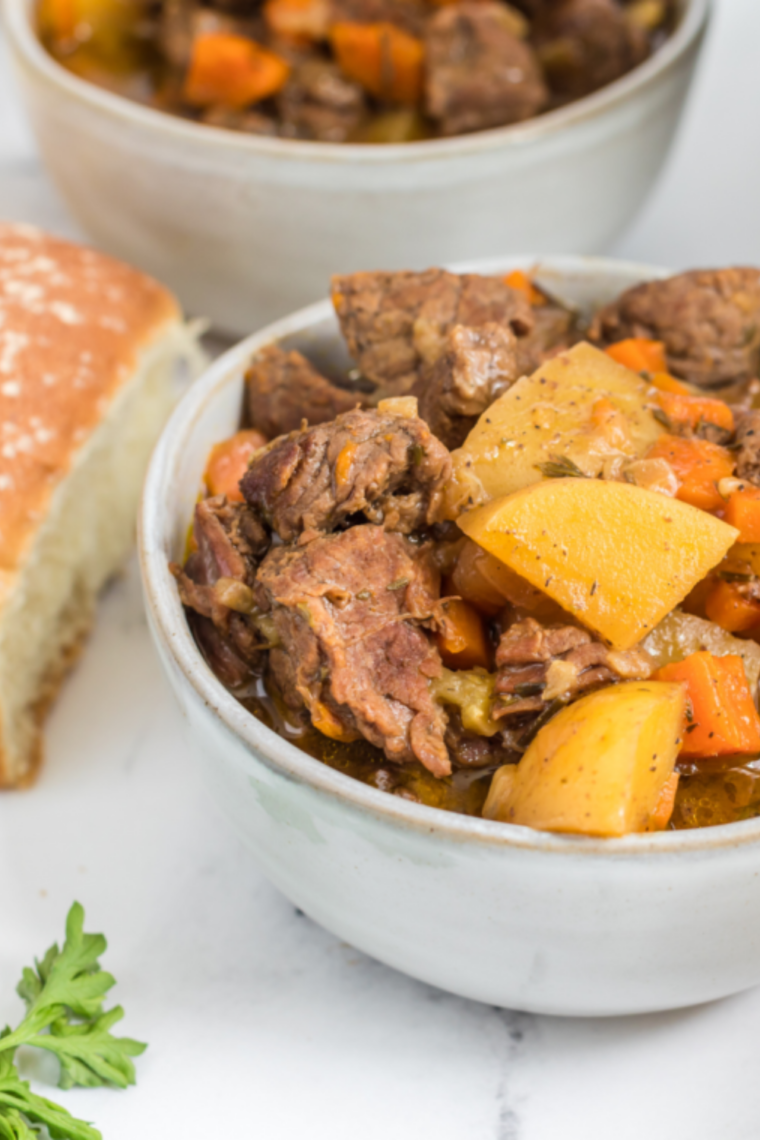 Homemade Dinty Moore beef stew with tender beef chunks, potatoes, carrots, and rich savory gravy in a rustic bowl
