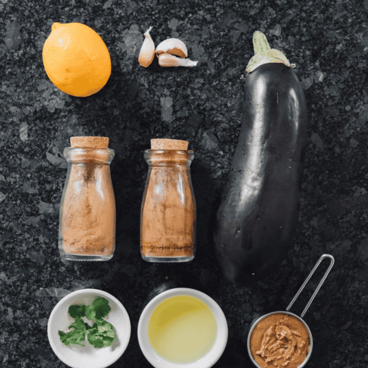 Ingredients needed for Easy Cava Roasted Eggplant Dip Recipe on kitchen table.