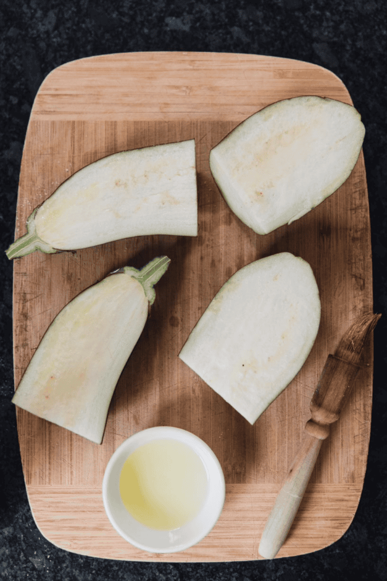 Eggplants sliced in half and scored in crisscross pattern for roasting