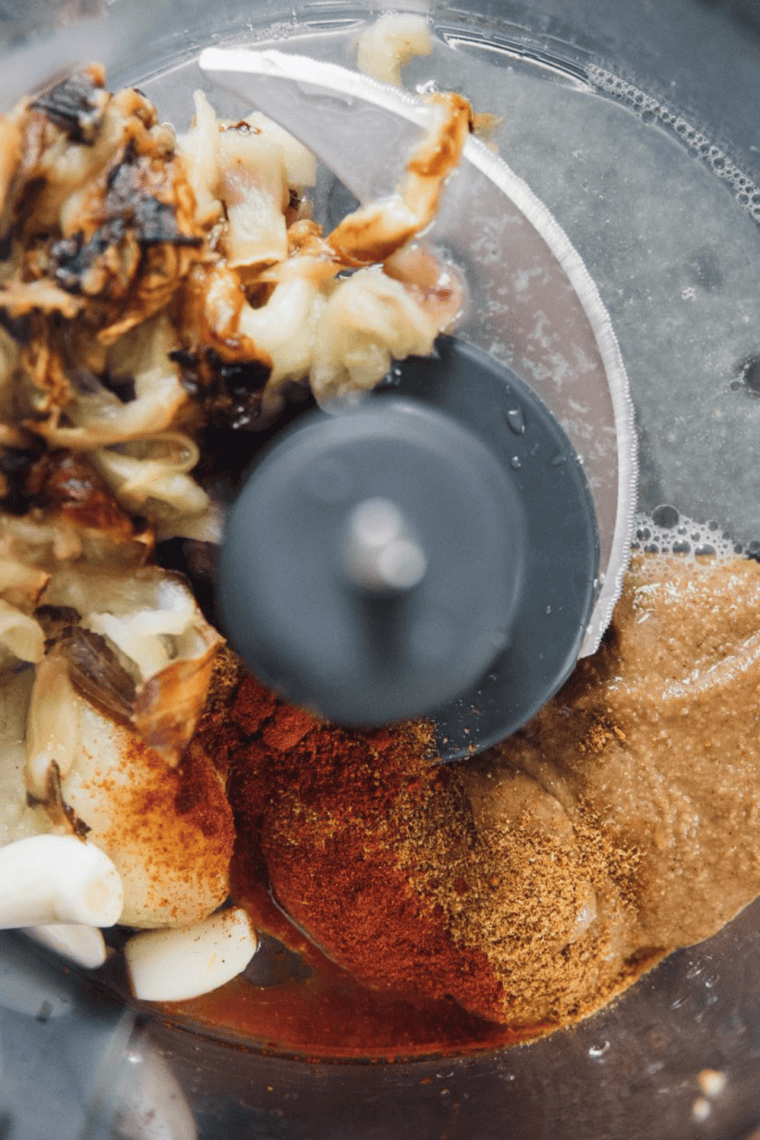 Roasted eggplant cooling slightly after baking for easier handling