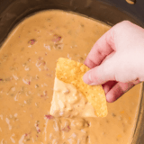 If you need a party dip that disappears faster than you can say &ldquo;grab a chip,&rdquo; this is it. This crock pot cream cheese taco dip is ridiculously creamy, loaded with bold taco flavor, and takes almost no effort to throw together.