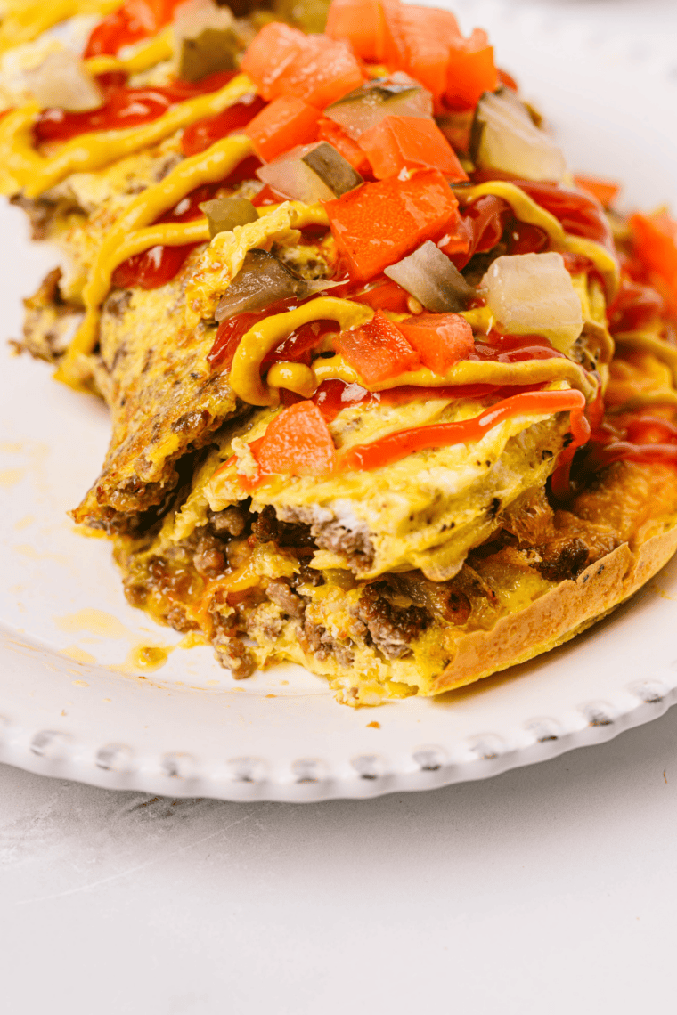 Air fryer omelet cooking at 300&deg;F until set, then rested and sliced for serving