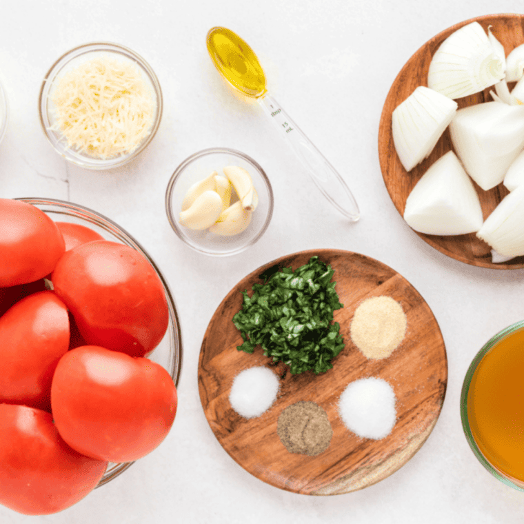 Chopped fresh tomatoes, garlic, and onion ready to saut&eacute; in olive oil.