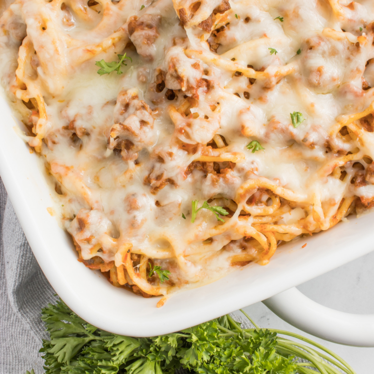 Baked spaghetti casserole inspired by Fazoli&rsquo;s with layers of spaghetti, meat sauce, and melted mozzarella cheese baked until golden and bubbly.