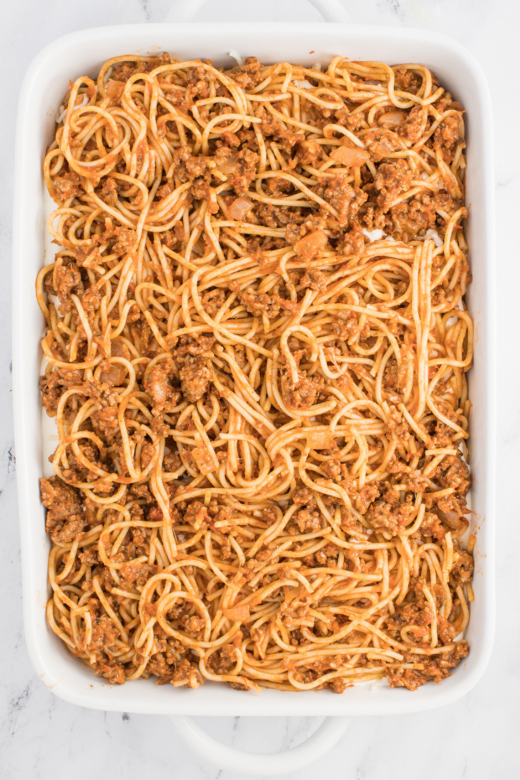Baked spaghetti casserole inspired by Fazoli&rsquo;s with layers of pasta, meat sauce, and melted mozzarella cheese baked until golden and bubbly.