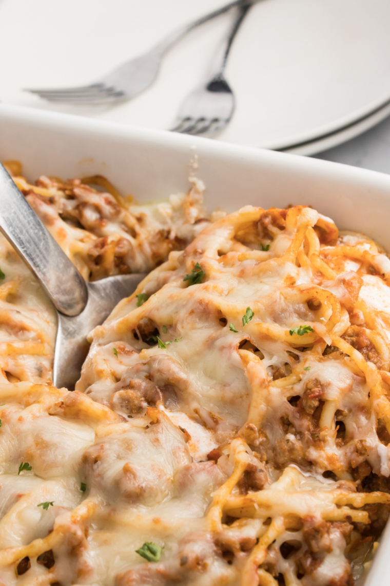 Baked spaghetti casserole inspired by Fazoli&rsquo;s with layers of pasta, meat sauce, and melted mozzarella cheese baked until golden and bubbling.