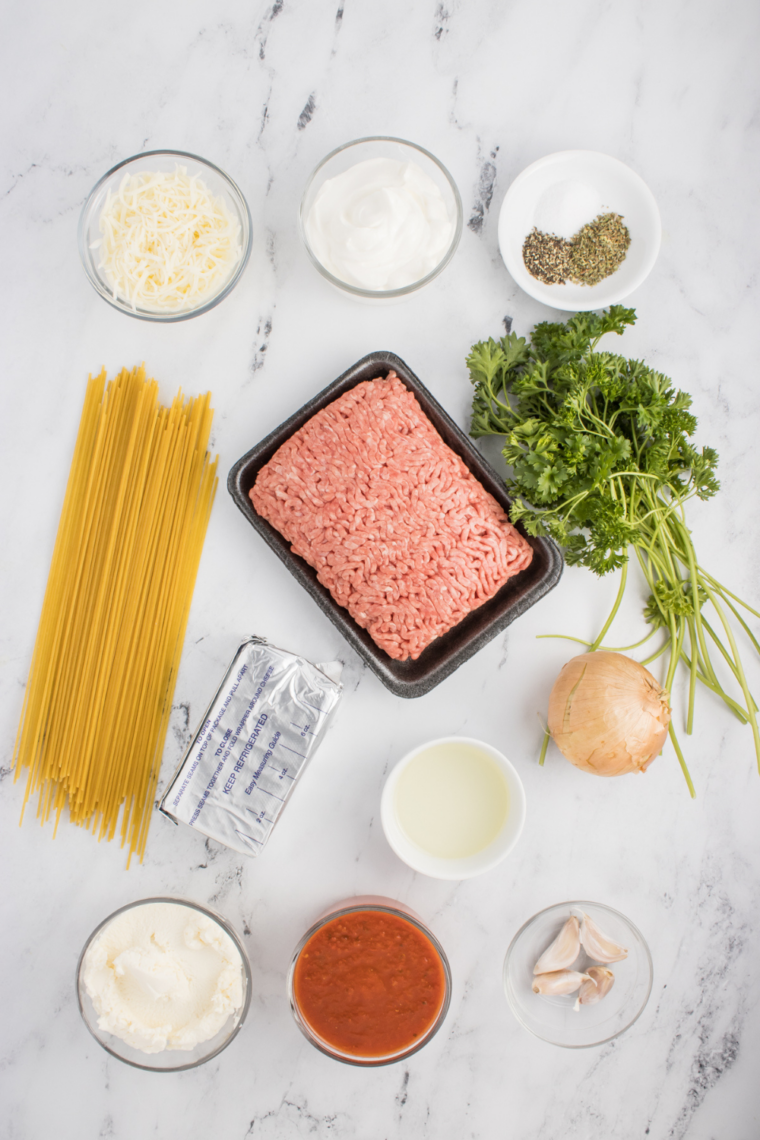 Ingredients needed for Fazoli's Baked Spaghetti Recipe on kitchen table.