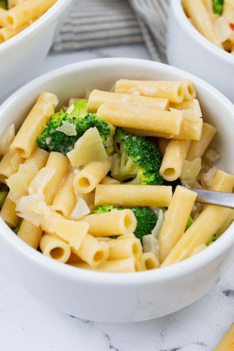 Creamy baked chicken broccoli penne inspired by Fazoli&rsquo;s with tender chicken, roasted broccoli, Alfredo sauce, and melted cheese on top